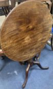 A George III mahogany circular tilt-top table, diameter 75cm, height 72cm