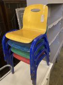 A set of four metal and ply child's stacking chairs