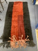 A central Asian red / black wool runner, 380 x 100cm