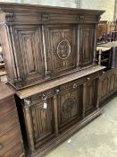 An early 20th century Flemish carved walnut cabinet, width 160cm, depth 55cm, height 188cm