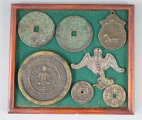 A group of Sino-Sanskrit bronze amulets/charms, 19th century or earlier, tray 1CONDITION: Provenance