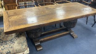 An oak refectory table, the top (formerly a door), length 209cm, depth 85cm, height 73cm