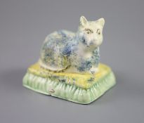 A Staffordshire Prattware figure of a recumbent cat, c.1830, height 7.5cmCONDITION: Provenance: