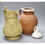 An ornate 19th century jug, another and a cream glazed Worcester jug, tallest 29cm