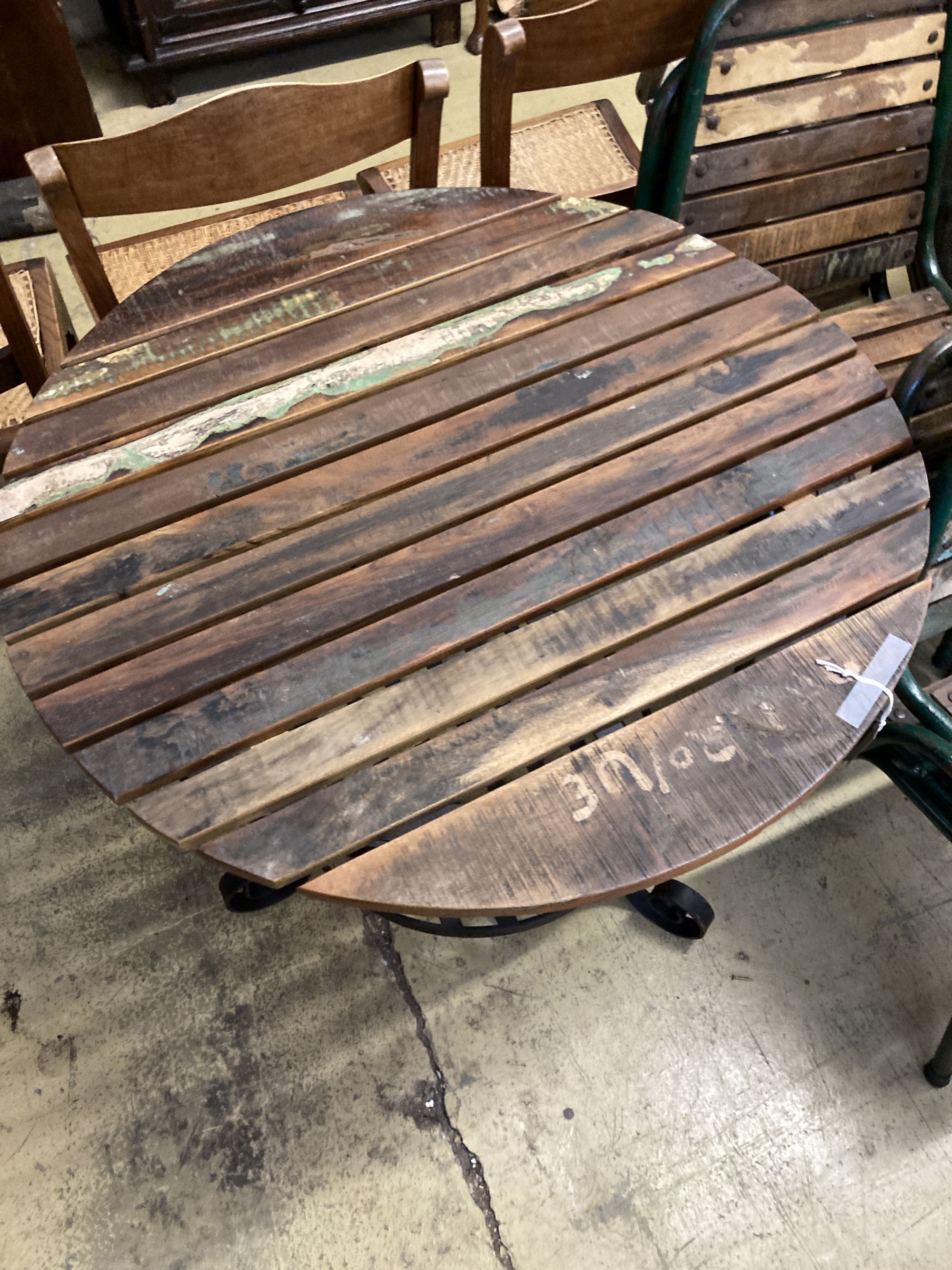 A circular slatted wood and wrought iron garden table, 85cm diameter, height 78cm together with a - Image 3 of 5