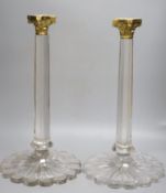 A pair of large glass corinthian column candlesticks, with gilt metal sconces, height 51cm