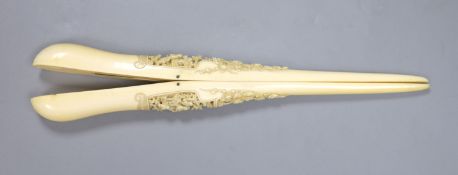 A pair of 19th century Cantonese export carved ivory glove stretchers, with finely carved panels