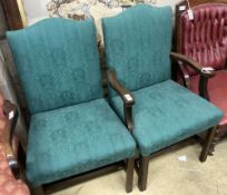 A pair of George III mahogany upholstered dining chairs (one with arms), width 62cm depth 52cm