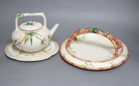 A Wedgwood Aesthetic period bamboo sprig teapot and stand and a basket