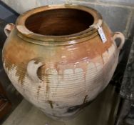 A large glazed earthenware garden urn, 86cm diameter, height 72cm