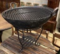 A circular wrought iron fire pit, 72cm diameter, height 54cm