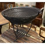 A circular wrought iron fire pit, 72cm diameter, height 54cm