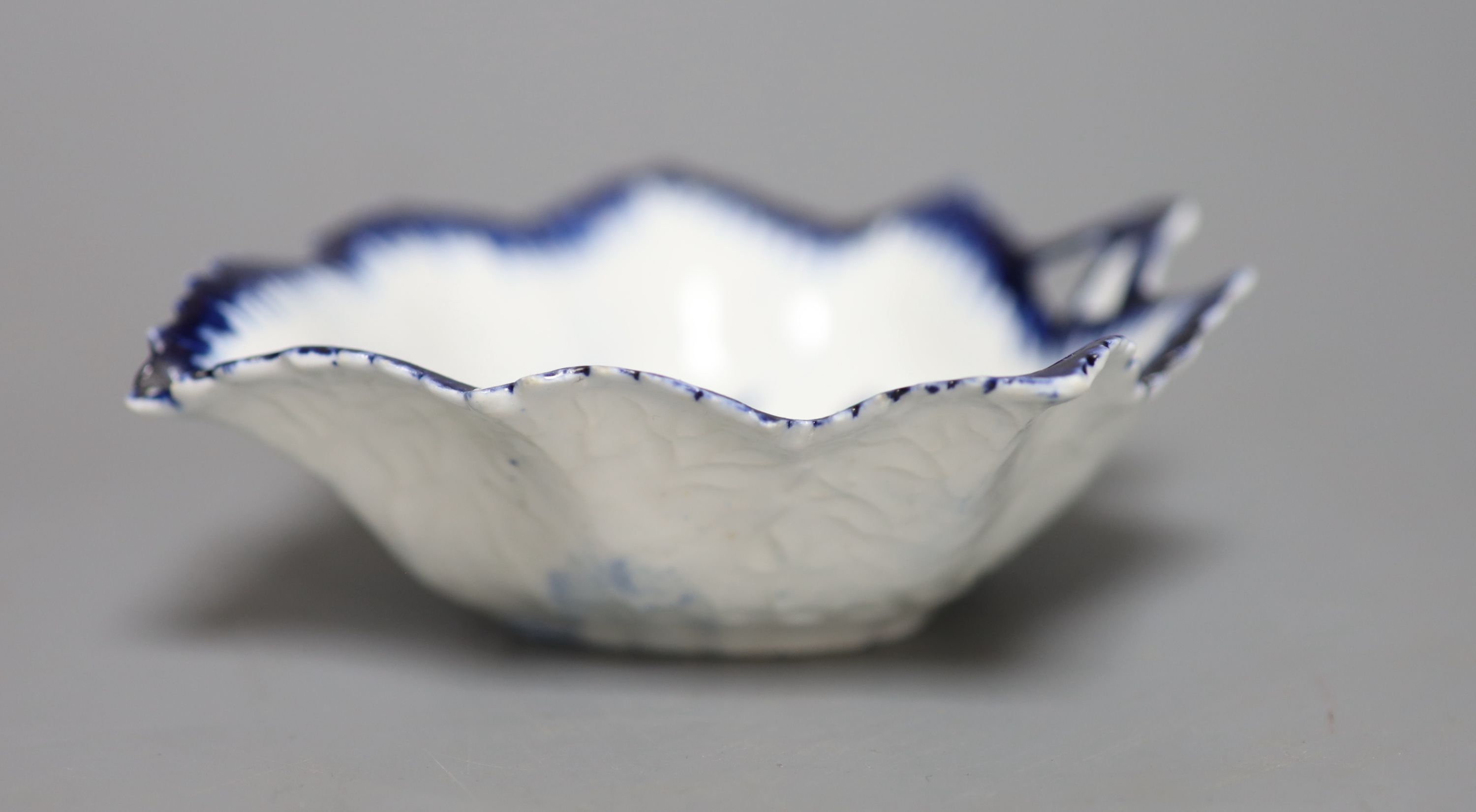 An 18th century Derby leaf shaped pickle dish decorated with flowers, in blue under a feather edge - Image 2 of 3