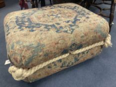 A rectangular Persian rug footstool, length 76cm, depth 60cm, height 38cm