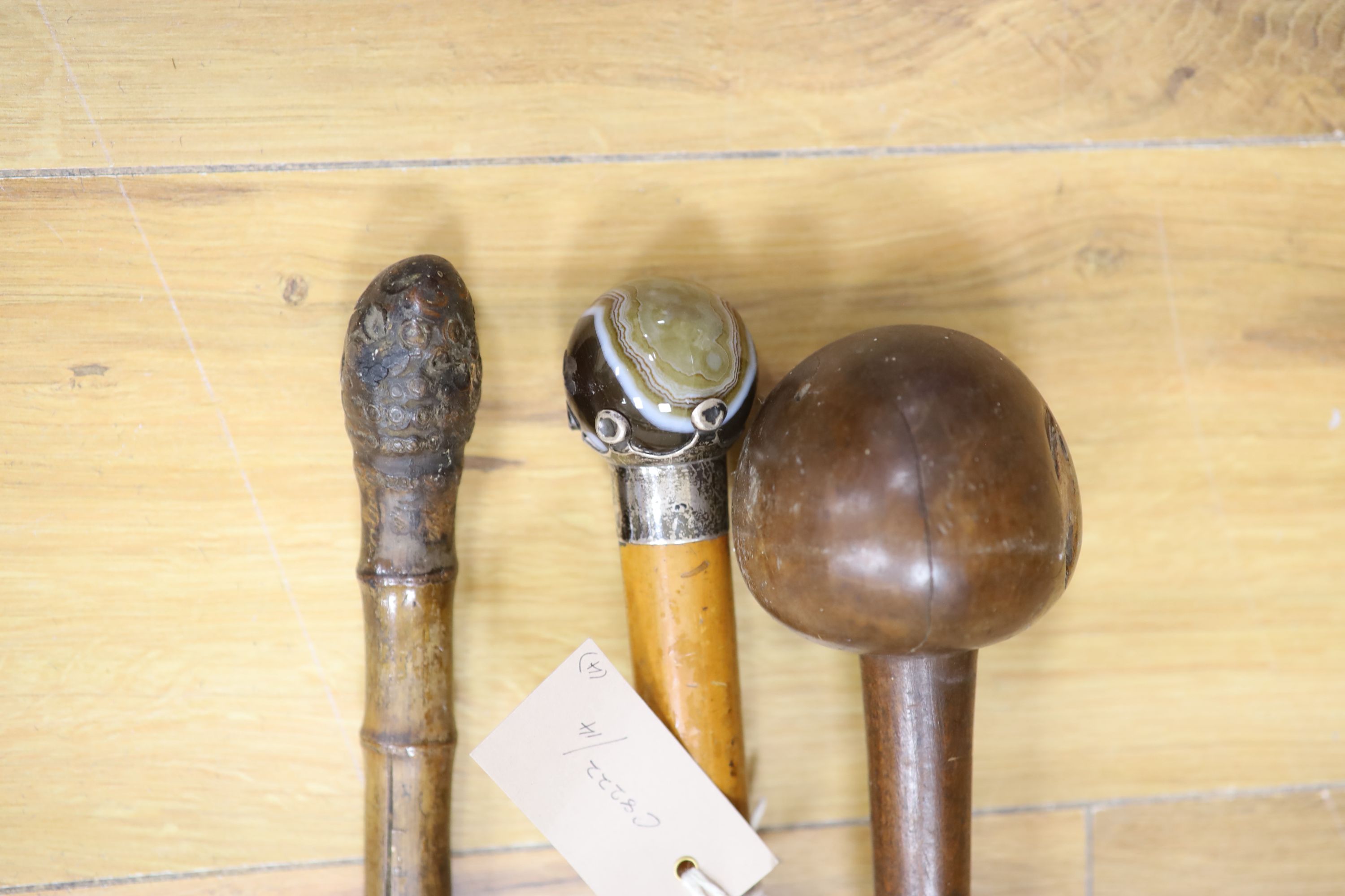 A sword stick, a knobkerrie and an agate mounted cane - Image 3 of 3
