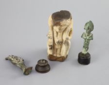 Two Egyptian bronze statuettes of Osiris and a sculpted limestone figure fragment, Ptolemaic period,