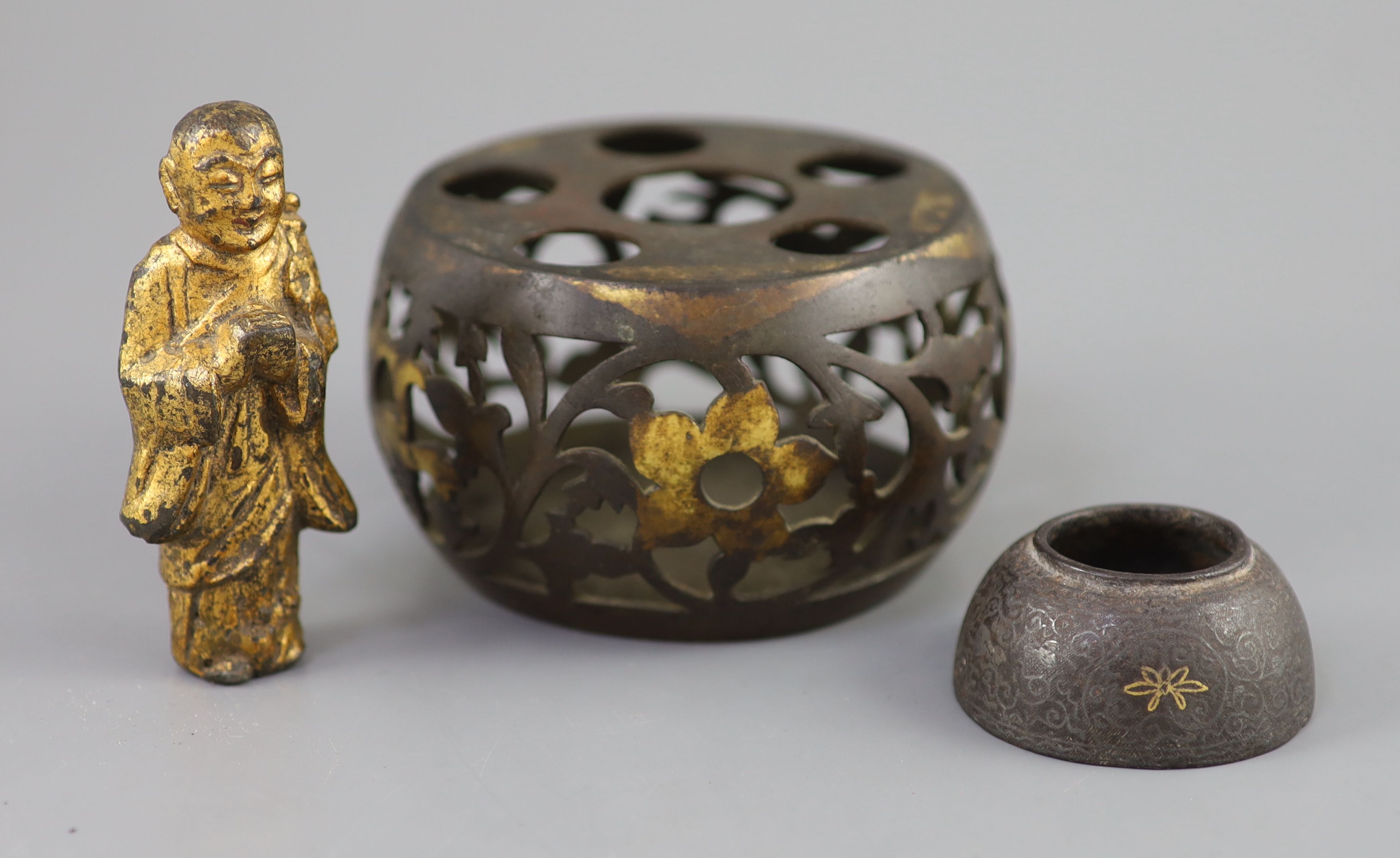 A Chinese bronze drum-shaped stand, a gilt bronze figure of a monk, 17th/18th century and a silver