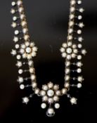 An Edwardian gold and pearl set necklace, lacking pendant attachment, 40cm, gross weight 30 grams.