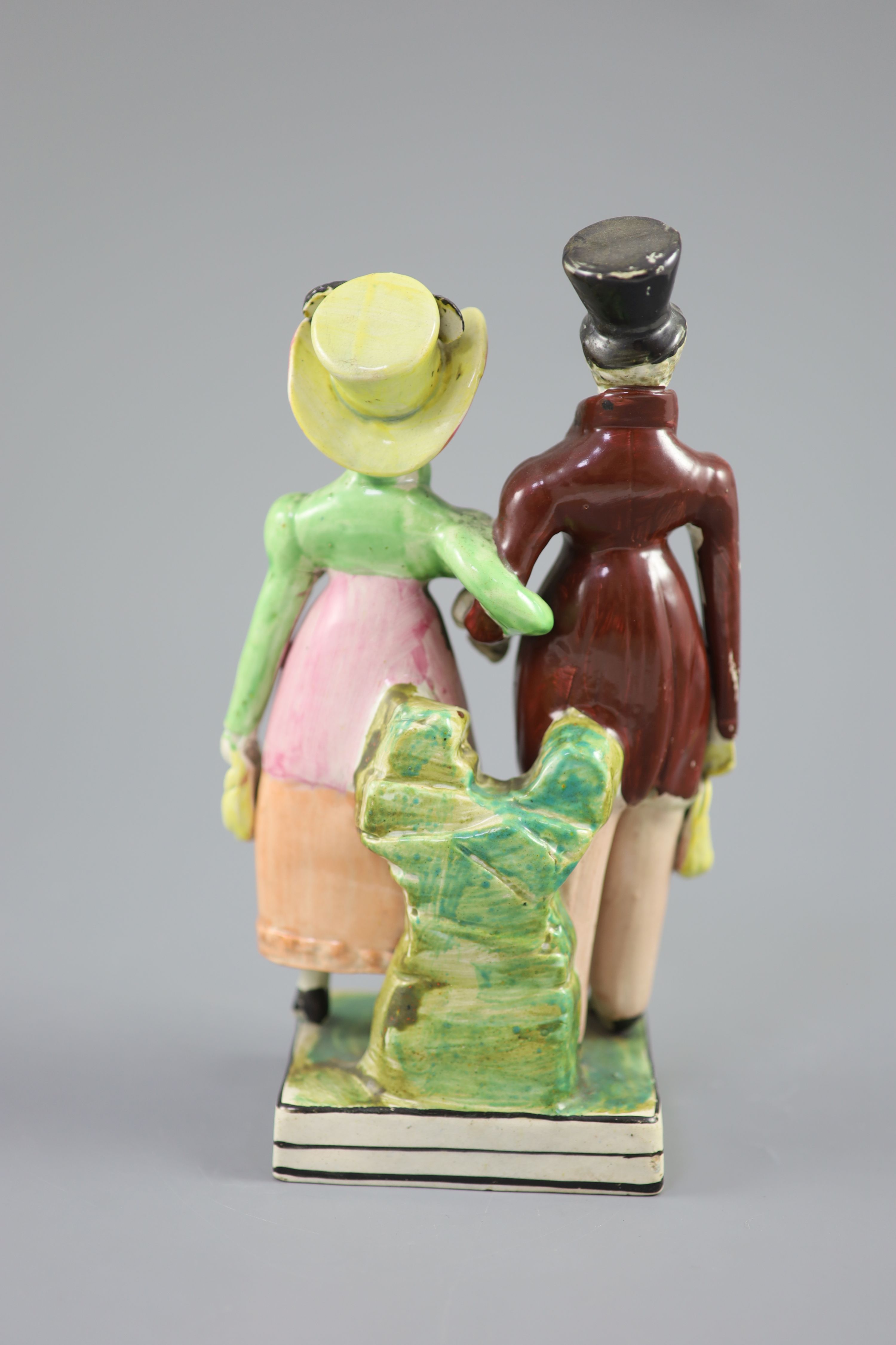 A Staffordshire pearlware group of a Dandy and Dandizette, c.1820, standing before rockwork on a - Image 4 of 5