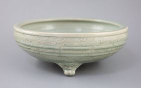 A large Chinese Longquan celadon tripod censer, Ming dynasty, 15th century, unglazed patch to the