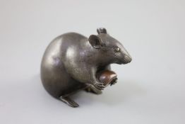 A Japanese bronze model of a rat holding a chestnut, Meiji period, incised Kakihan mark to base,