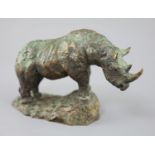 § Hamish Mackie (1973-). A bronze model of a rhinoceros, standing upon a naturalistic base,