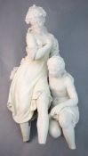 A white marble group of two classical bathers, one partially clad, the other a kneeling nude, height