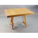 A Guillerme & Chambron golden oak draw leaf dining table, with extending rectangular top on stylised