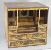 A Japanese gilt decorated black lacquer shrine cabinet, 19th century, the top and sides decorated