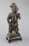 A Chinese bronze standing figure of Guandi, 16th/17th century, wearing armour and robes with flowing