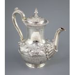 A Victorian silver coffee pot by Richard Sibley II, of baluster form, with acanthus leaf capped
