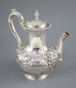 A Victorian silver coffee pot by Richard Sibley II, of baluster form, with acanthus leaf capped