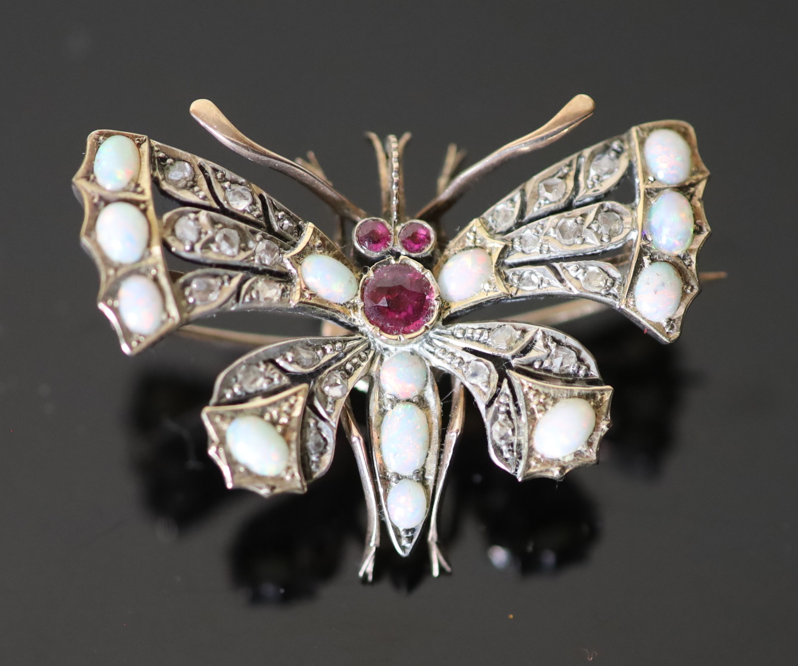 An Edwardian gold and silver, rose cut diamond, white opal and ruby set butterfly brooch, width - Image 2 of 3