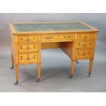 An Edwardian Edwards & Roberts marquetry inlaid satinwood kneehole desk, with tooled green skiver