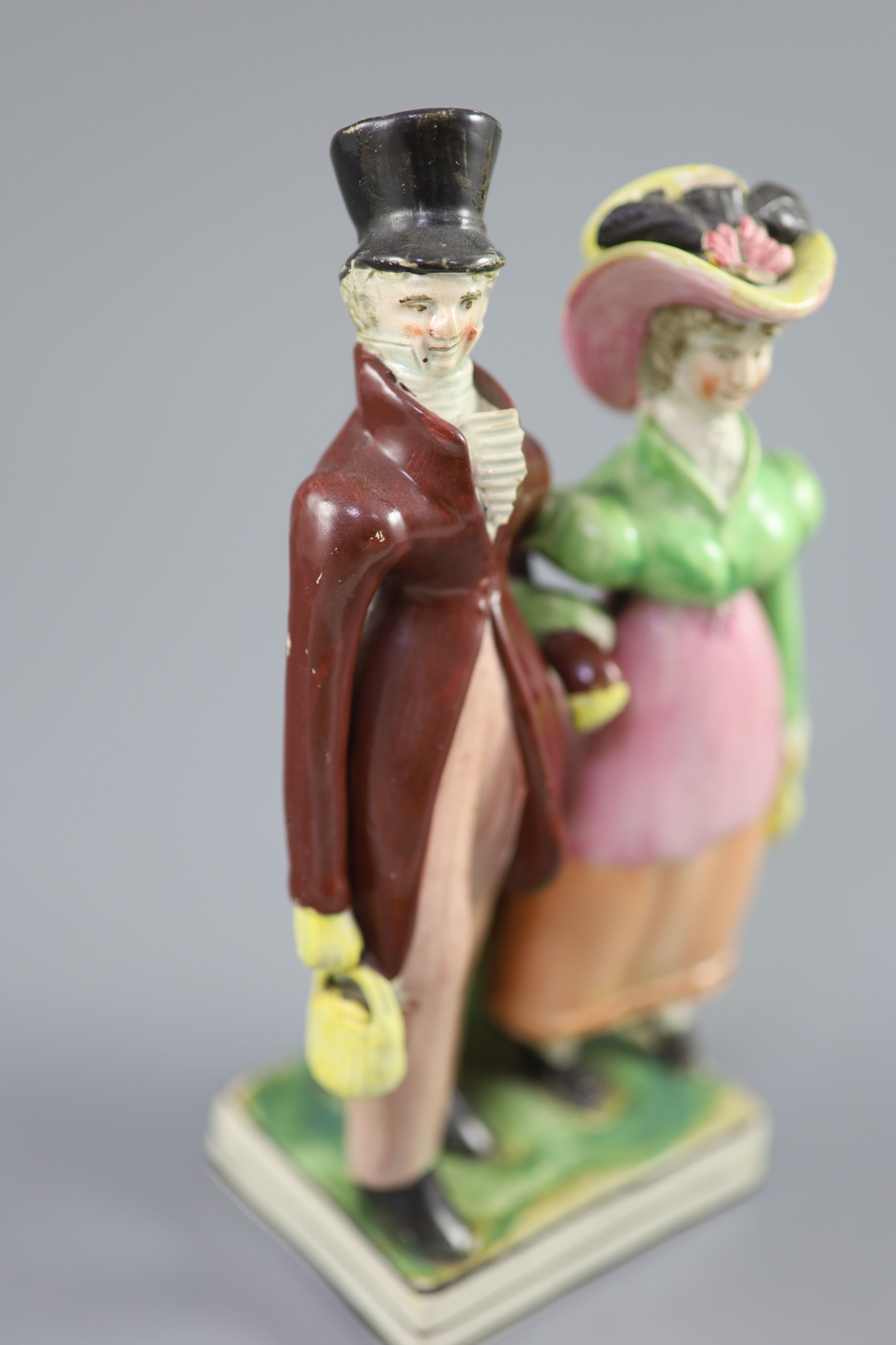 A Staffordshire pearlware group of a Dandy and Dandizette, c.1820, standing before rockwork on a - Image 2 of 5