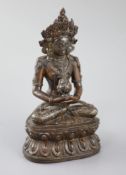 A Tibetan silver and gold inlaid copper alloy figure of Amitayus/Amitabha, c.15th century, seated in