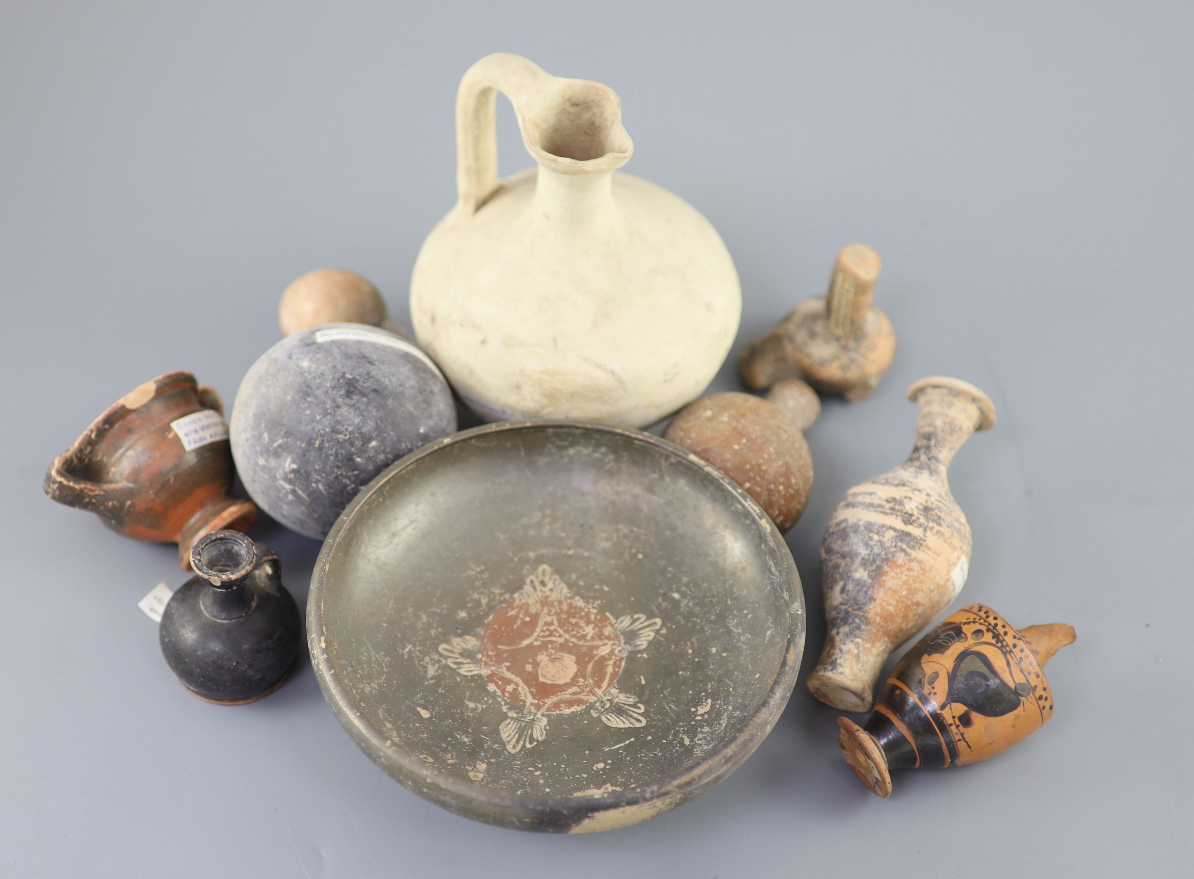 A group of Ancient Greek pottery vessels, Attic and Apulia, 4th-5th century BC, most with old