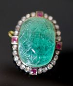 A late 19th century gold and silver, carved emerald, four stone ruby and twenty four rose cut