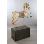 A 19th century, probably American, painted wood carousel horse, upon display stand, the horse with