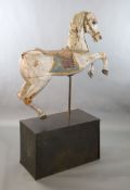 A 19th century, probably American, painted wood carousel horse, upon display stand, the horse with