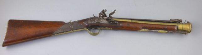 A late 18th century brass barrelled flintlock blunderbuss, by Jones, with chequered mahogany