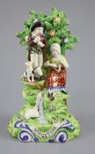 A John Walton Burslem Pearlware group 'Songsters', c.1815-20, on a titled scrollwork base picked out