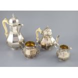 A late Victorian silver four piece Queen Anne style octagonal tea service by Elkington & Co, with