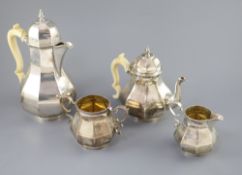 A late Victorian silver four piece Queen Anne style octagonal tea service by Elkington & Co, with