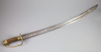 A late 17th century military hangar sword, with brass hilt, antler handle and blade engraved with