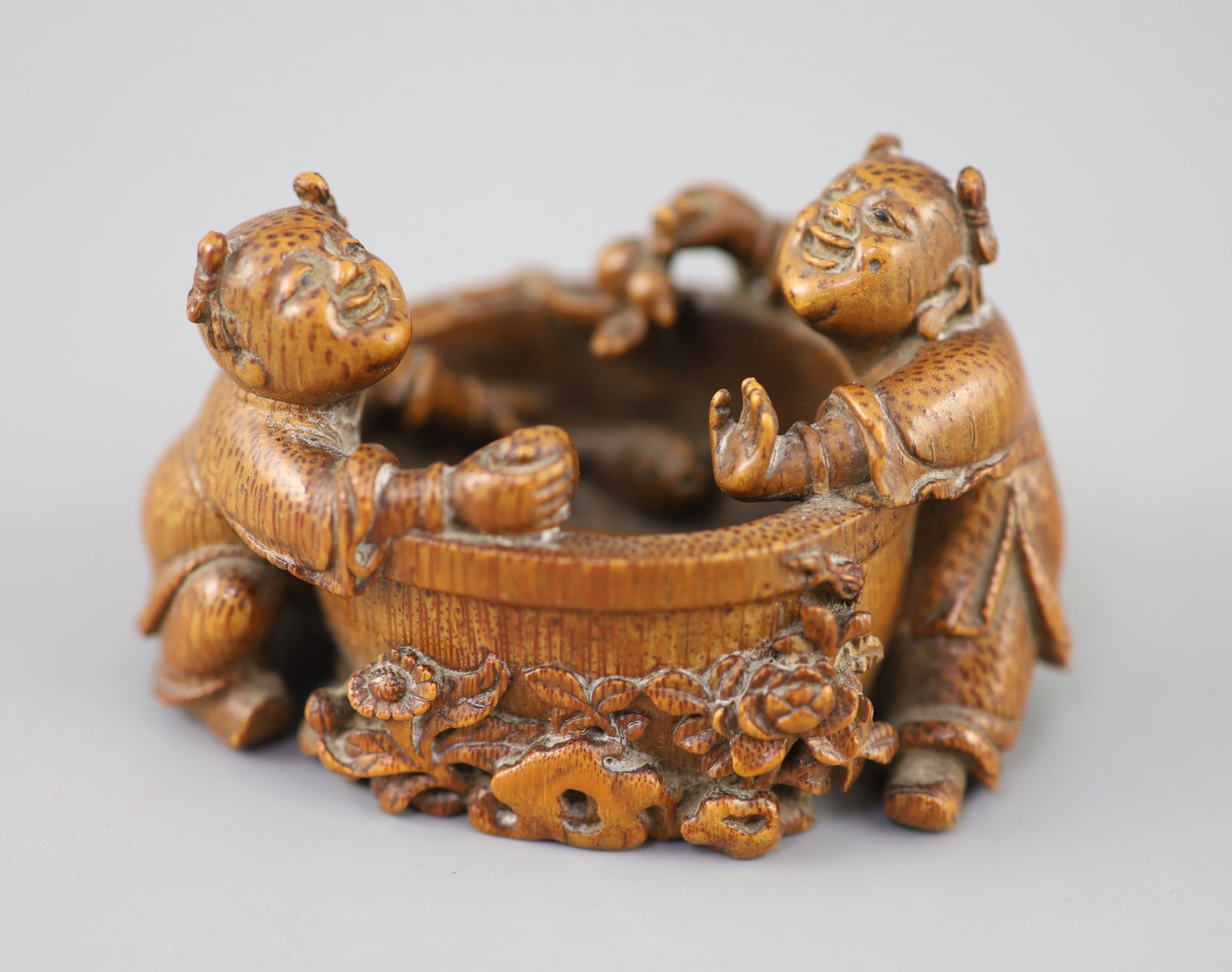 A fine and rare Chinese bamboo-root 'boys and fish bowl' brush washer, 18th/19th century, carved