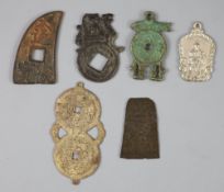 China, 5 bronze or white metal charms or amulets, Qing dynasty, of unusual form, together with one