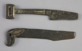 Two Chinese bronze knives, Ordos Culture, c.3rd century B.C. lacking the end of each blade, and