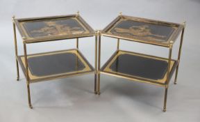 A pair of French brass and chinoiserie black lacquered two tier occasional tables, decorated with