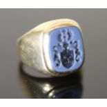 An early-mid 20th century 14ct gold and blue sardonyx set signet ring, the matrix carved with ornate